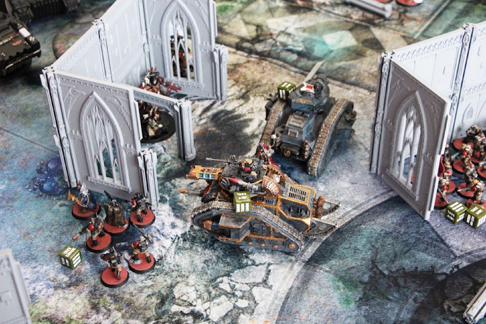 A game of Warhammer 40,000 between the Astra Militarum and the Black Templars. (Patrick Davies photo - simplymastery)