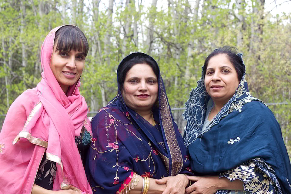 From left to right, Ritu Nijjar, Rani Mudhar and Kumvir Nijjar all smile during Vaisakhi celebrations at the 100 Mile House Gurudwara Sahib on May 10. (Misha Mustaqeem photo - simplymastery)