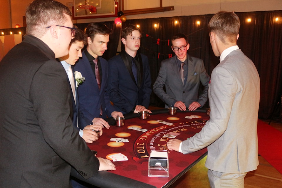 Ash Edwards, Lee Koch, Briton Lafreniere, Matthew Keller and Ethan Dawson at a dealer table at the 2024 PSO Dry Grad Prom Night. This year's theme is Hollywood Red Carpet. (Misha Mustaqeem photo - simplymastery)