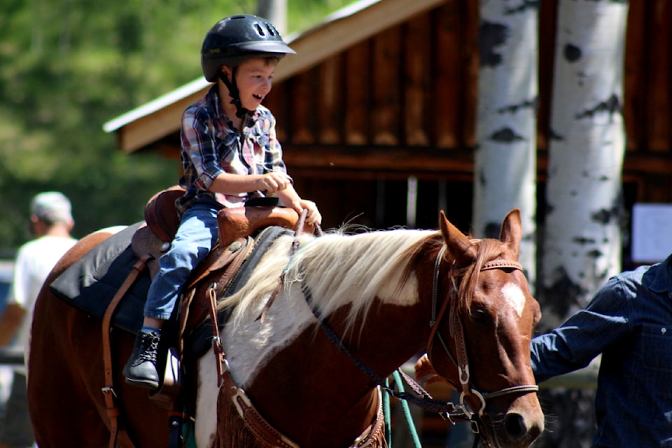 Kaden Lemak, a seven year old horse rider from Sheridan Lake, participates in the Watch Lake/Horse Lake gymkhana, near the Little Horse Lodge.