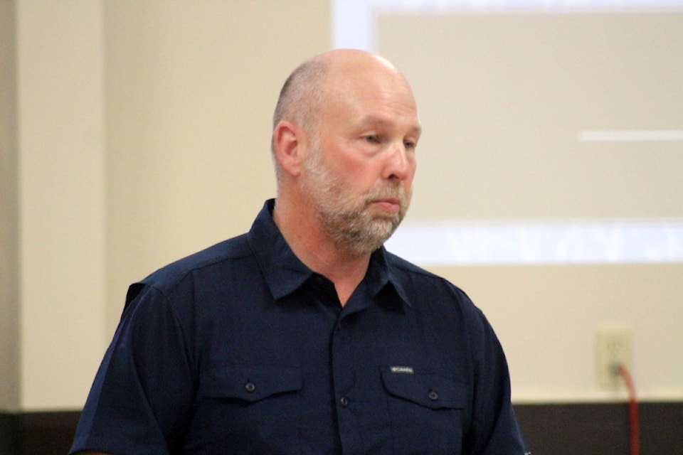 Paul Edmonds, the principal consultant at Red Dragon Consulting Ltd, presents the Community Evacuation Plan for the 103 Mile, 105 Mile and 108 Mile Ranch communities at a meeting on Tuesday night at the 108 Community Hall. Around 35 people attended. 