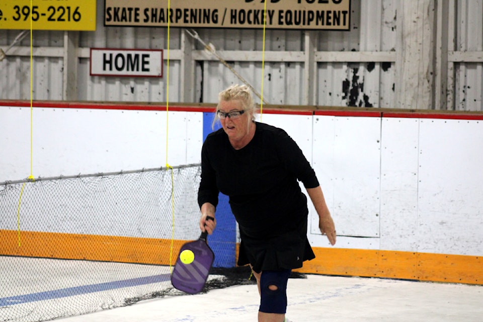 Carolee Hartigan attempts to hit the ball back during the drop-in try-out at the Rolf Zeis/Lac La Hache Arena on Saturday.