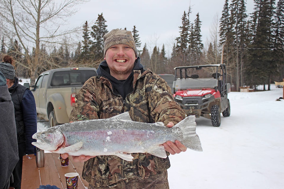 Brodie Braatan with his second-place fish at the Fourth Annual Fishing Highway 24 Ice Derby. (Photo submitted)