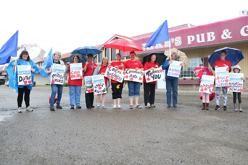 Around a dozen members of the 100 Mile House Hospital Employees Union, including a few of their family members, showed up on Saturday to thank 100 Mile House for all their support during the COVID-19 pandemic. (Patrick Davies photo - 100 Mile Free Press)