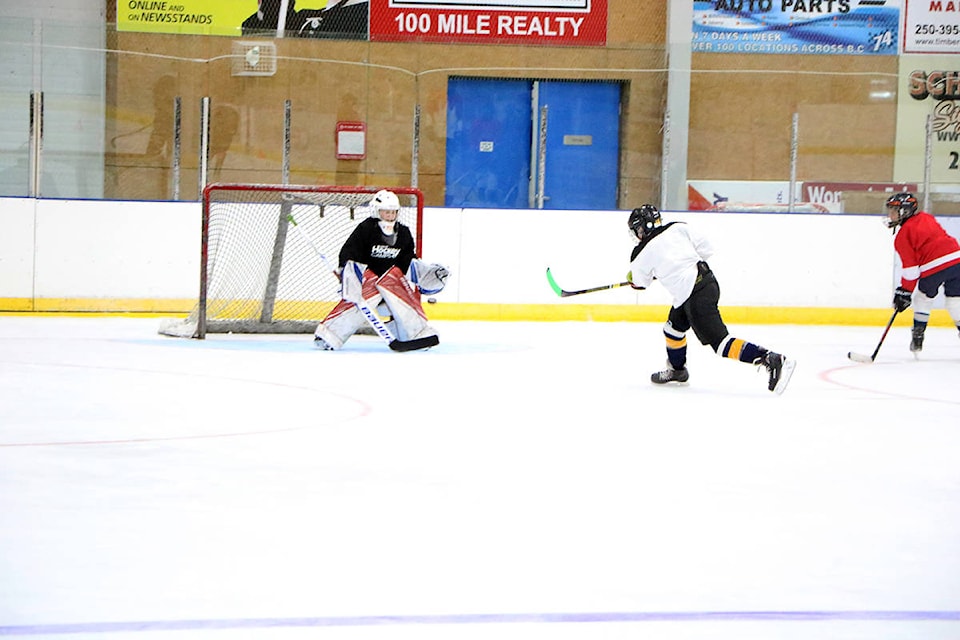 Graydon Forster blocks a shot from Matthew Bridal during a training camp at the South Cariboo Rec Centre. (Patrick Davies photo - 100 Mile Free Press)
