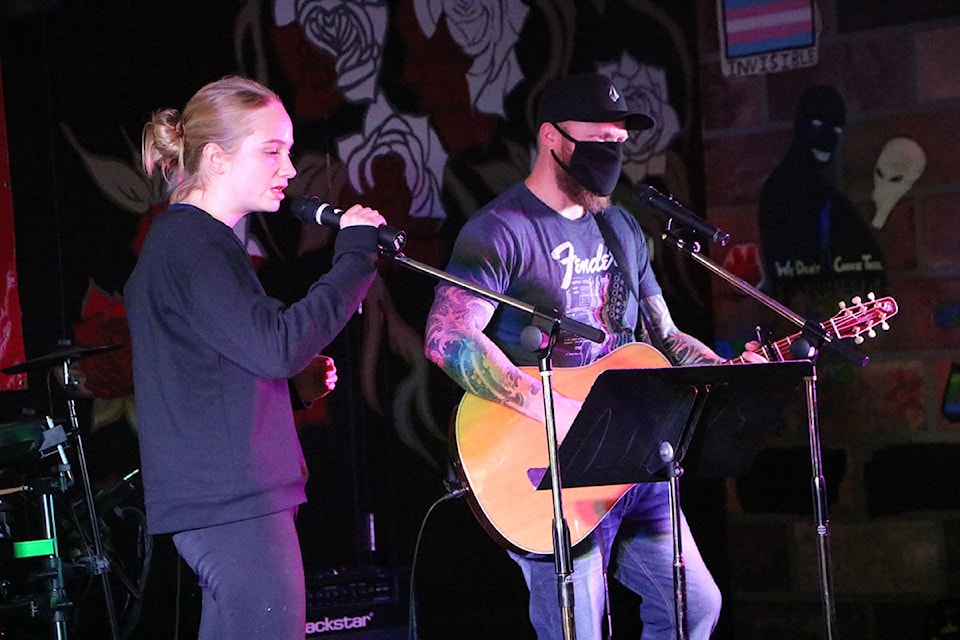 Autumn Vallee sings accompanied by her father Joe Vallee at the first cafe-style Amnesty Concert at Peter Skene Ogden Secondary School last month. (Patrick Davies photo - 100 Mile Free Press)
