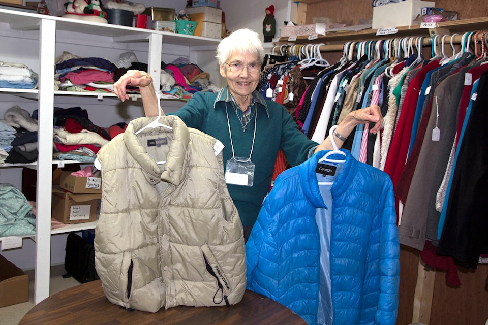 Wendy Hamblin, coordinator of the Free Store at St. Timothy’s St. Anglican Church, shows off a couple of coats ahead of the Coats for All 2020 campaign, which kicked off Nov. 1. (Kelly Sinoski photo, 100 Mile Free Press).