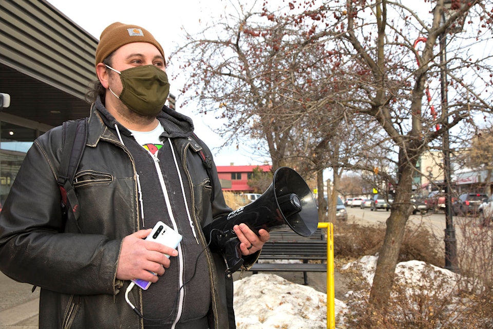 Aaron Thomas amplified Dr. Bonnie Henry’s message on Birch Avenue Saturday, Dec. 5, as a counter-protest to a march by 40 protesters who claim their rights and freedoms are being threatened during the COVID-19 pandemic. (Kelly Sinoski photo- 100 Mile Free Press).