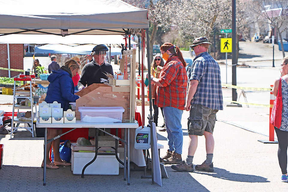 24584535_web1_100-Mile-Farmers-Market-Donation-to-Cover-lost-money-box_5