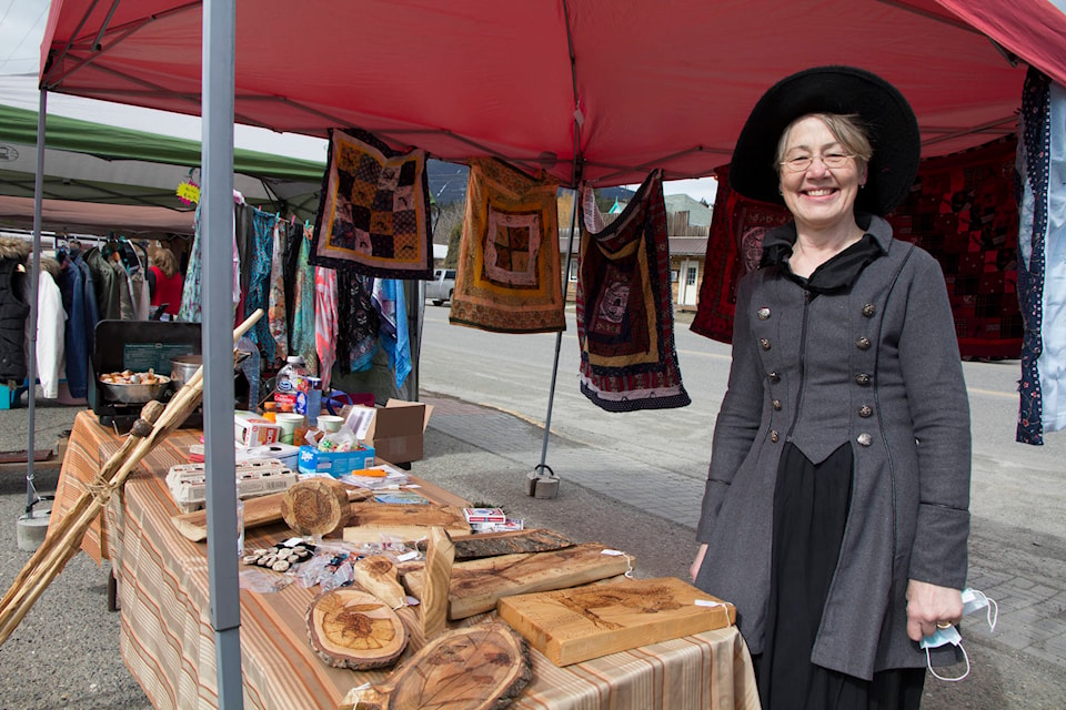 Bernice Weihs-Anderson creates art with reclaimed wood and flogs it at the Clinton Outdoor Market. (Kelly Sinoski photo - 100 Mile Free Press).