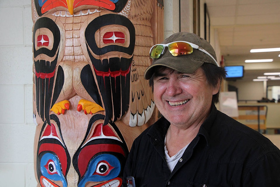 Canim Lake carver Jerome Boyce was happy to carve a new Secwepemc entranceway for Peter Skene Ogden Secondary School. (Patrick Davies photo - 100 Mile Free Press)