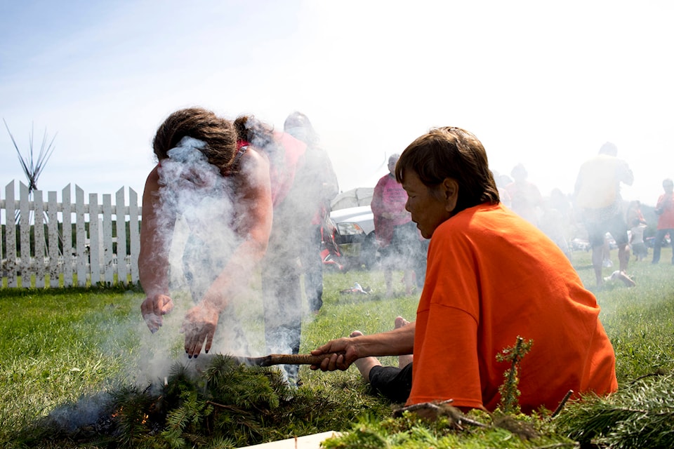 Smudging being held at the healing ceremony. Smudging is traditionally a ceremony for cleansing the soul of negative thoughts. (Aman Parhar/Omineca Express)