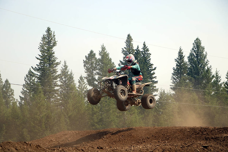 Isaac Borden-Sayah catches some air while riding his ATV in 100 Mile House. (Patrick Davies photo - 100 Mile Free Press)