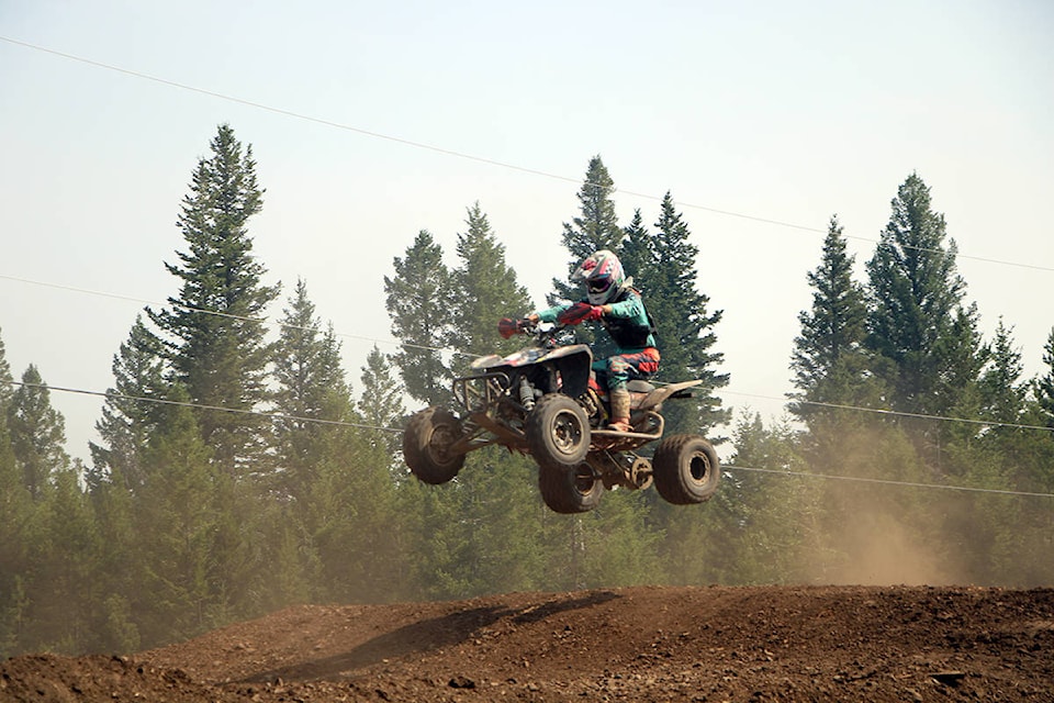 Isaac Borden-Sayah catches some air while riding his ATV in 100 Mile House. (Patrick Davies photo - simplymastery)
