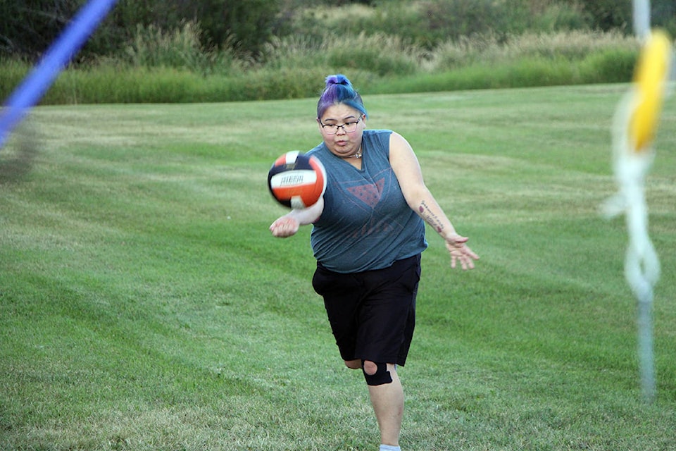 Mary Ann Finch makes a serve while playing a game of volleyball. (Patrick Davies photo - 100 Mile Free Press)