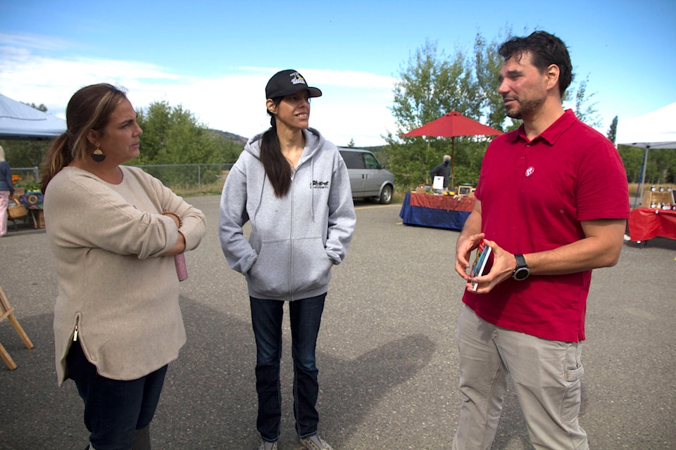 Liberal candidate Jesse McCormick, right, visits with South Cariboo Farmers’ Market manager Amanda Patterson, left, and Dianne Bob on a trip to 100 Mile House last weekend. (Kelly Sinoski photo - 100 Mile Free Press).