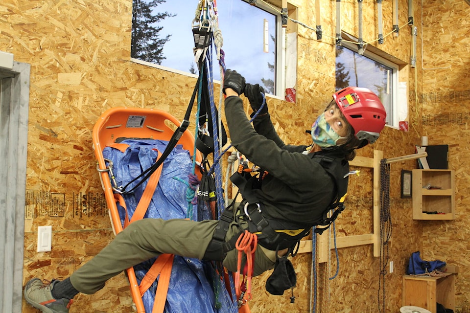 Jean Swann works on vertical rope technique at the South Cariboo Search and Rescue practice. (Melissa Smalley - 100 Mile House)