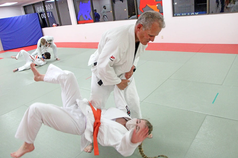 Ian Briggs, sensei of Kokoro Judo, flips orange belt Tai St Pierre to the mats during the second practice back since March 2020. (Patrick Davies photo - 100 Mile Free Press)