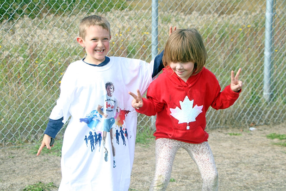 Archer Hermiston and Ellie Seniw ran the Terry Fox Run together at Mile 108 Elementary School. Archer was happy to win the school raffle for a Terry Fox shirt, which he wore throughout the run. (Patrick Davies photo - 100 Mile Free Press)