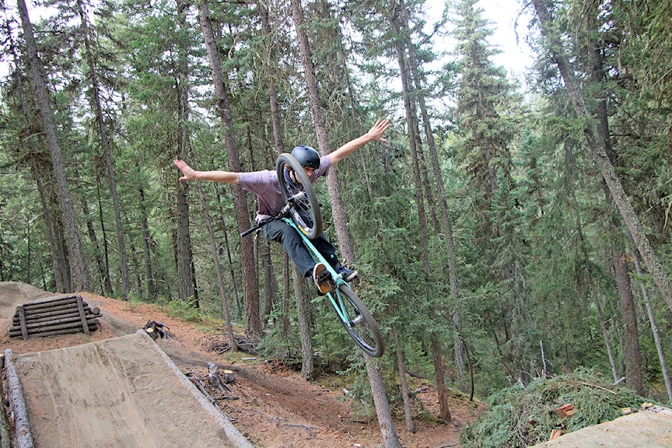 Using only his legs Marcus Cant clings onto his bike as he jumps through the air. (Patrick Davies photo - 100 Mile Free Press)