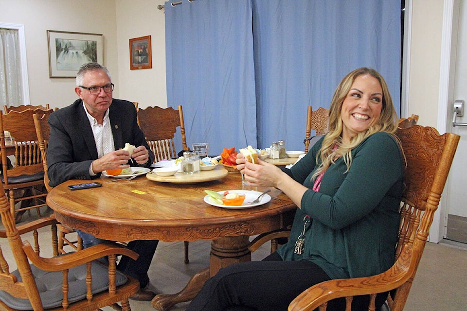 MLA Lorne Doerkson and Carefree Manor general manager Alana Bucci broke bread together during a tour of Carefree Manor .last Saturday. The two enjoyed the same meal residents received that night, a turkey sandwich, fresh fruit and mandarin flavoured jello. (Patrick Davies photo - 100 Mile Free Press)