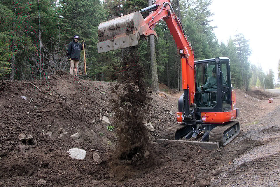 Dalton Anderson has spent several days with friends like Noah Dykstra working on new features added to the Huncity Mountain Bike Club trail system. (Patrick Davies photo - simplymastery)