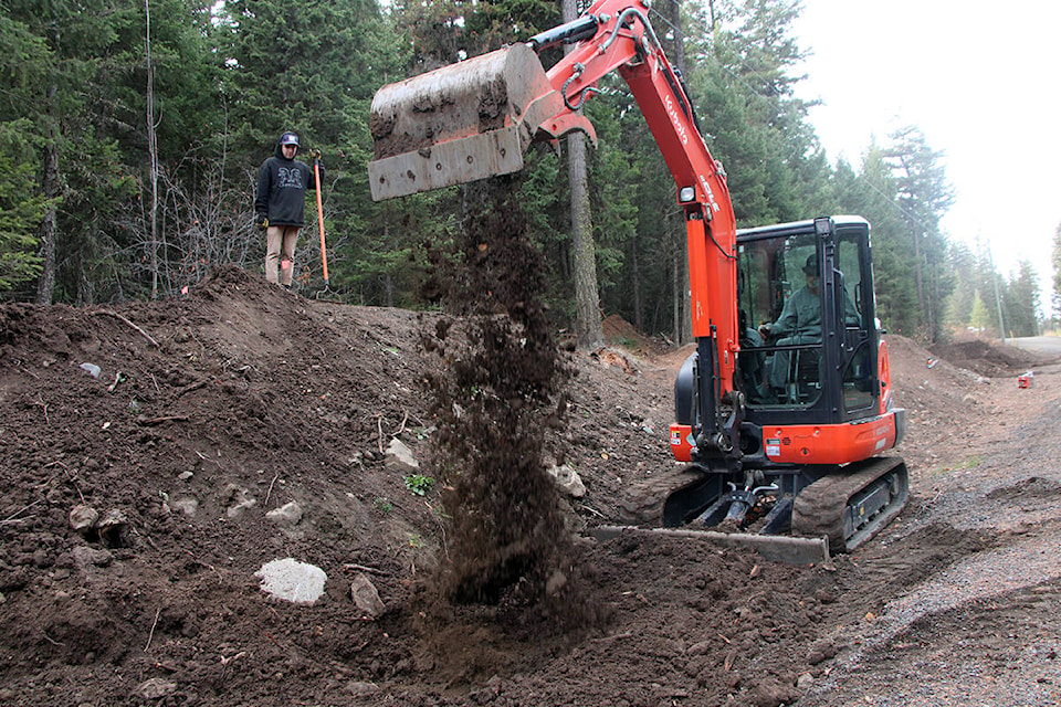 Dalton Anderson has spent several days with friends like Noah Dykstra working on new features added to the Huncity Mountain Bike Club trail system. (Patrick Davies photo - 100 Mile Free Press)