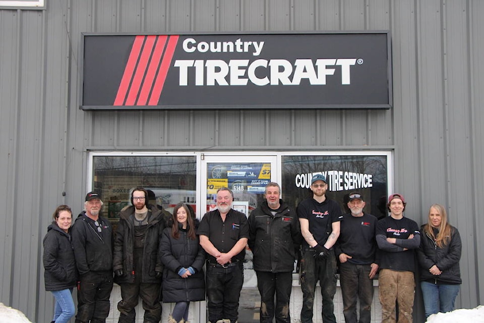 The Country Tire Service team gained a new leader and owner this month in form of Frank Endersby (fourth from left) who took over from former owner George Eburne (fourth from right). (Patrick Davies photo - 100 Mile Free Press)
