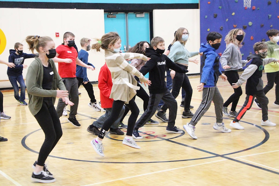 Members of the Grade 5/6 class of Mile 108 Elementary School feel the groove as they learn how to hip hop dance.(Patrick Davies photo - 100 Mile Free Press)