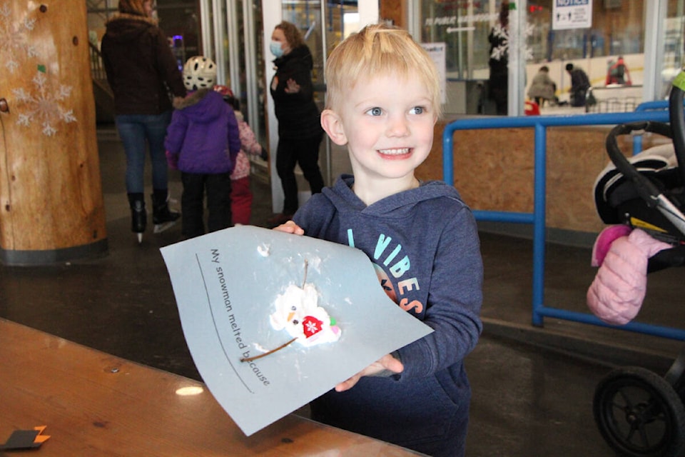 Bennett Morrow proudly shows off his handmade snowman at 100 Mile House’s Winterfest last Thursday. (Patrick Davies photo - 100 Mile Free Press)