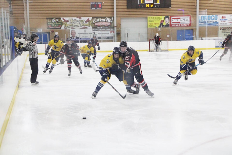 The 100 Mile House Wranglers clash against the Chase Heat Friday at the South Cariboo Rec Centre. (Patrick Davies photo - 100 Mile Free Press)