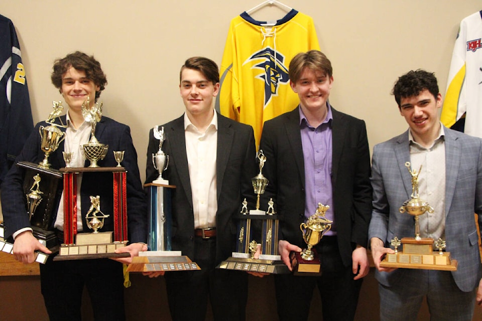 From left: Loic Mainguy-Crepault, Ethan Sanders, Tyler Lalikeas and Reid Stumpf show off their trophies awarded at the Wranglers’ annual award banquet last Wednesday. (Patrick Davies photo - 100 Mile Free Press)