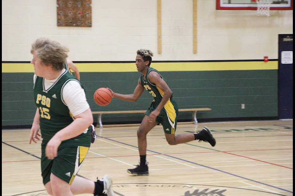 Mohamed Omer dribbles the ball down the court at Peter Skene Ogden Secondary School. (Patrick Davies photo - simplymastery)
