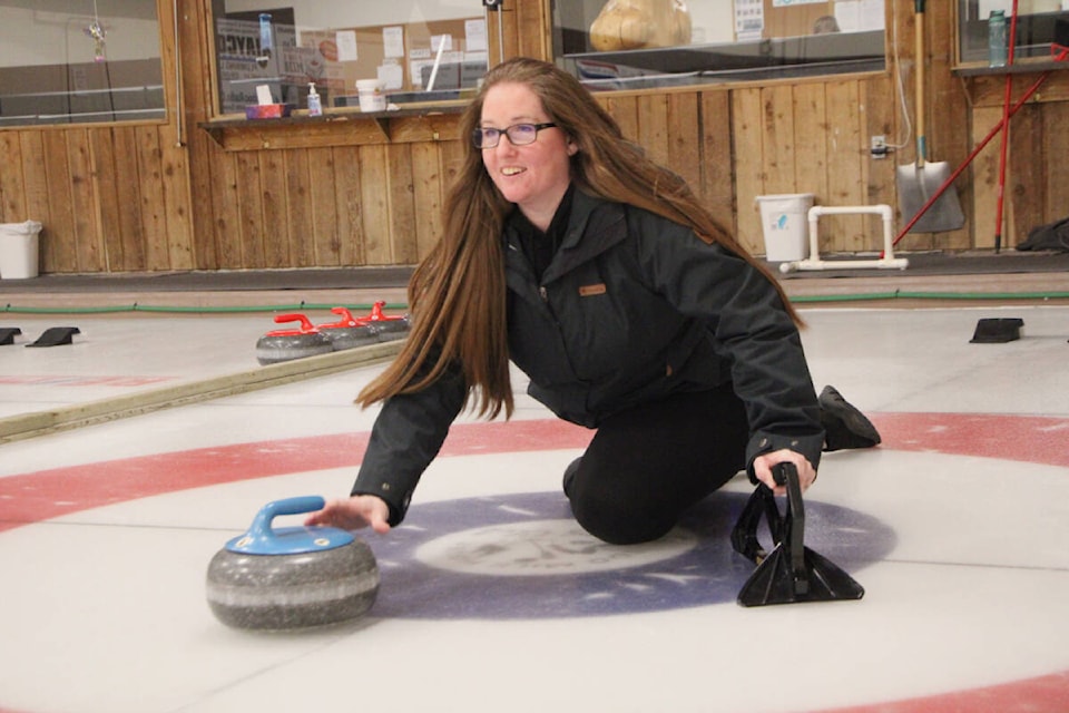 Kristy Gosselin releases a rock in the second day of playing in the Open Doubles Bonspiel. (Patrick Davies photo - simplymastery)