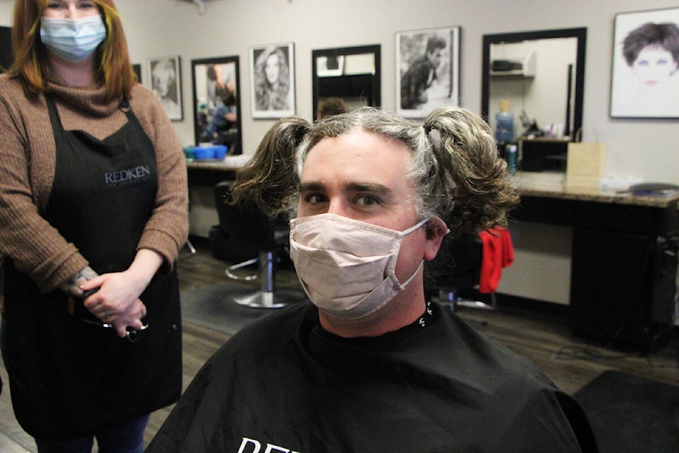 PSO teacher Chris Leflufy had his hair cut for cancer last Saturday at JD’s Salon. Leflufy donated nine inches of hair to Hair Inc. to turn into wigs as well as $710 to BC Children’s Hospital. He decided last year to let his hair grow out and donate it to a good cause. (Patrick Davies photo - 100 Mile Free Press)