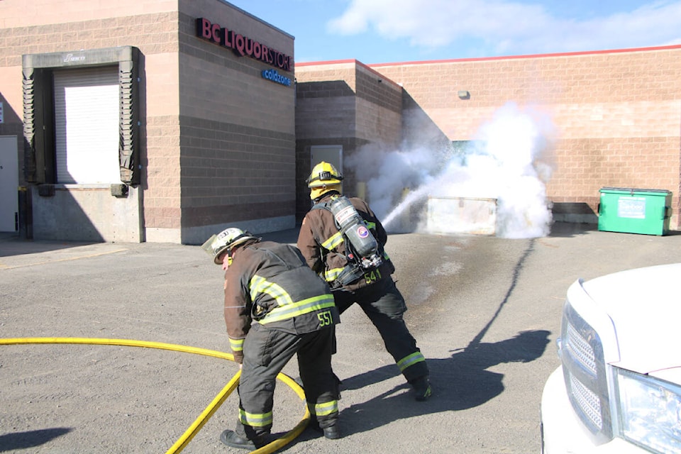 100 Mile Fire Rescue firefighters extinguished a dumpster fire behind the Pet Valu in 100 Mile House. (Patrick Davies photo - 100 Mile Free Press)