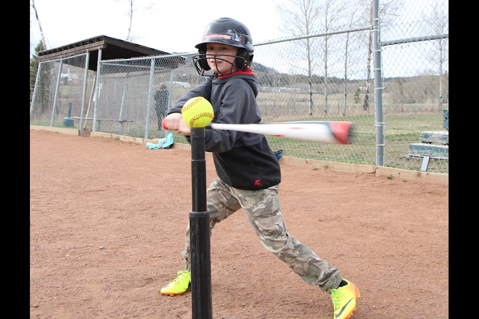 Laeken Allenby steps up to bat during one of the first softball practices of the season. (Patrick Davies photo - 100 Mile Free Press)