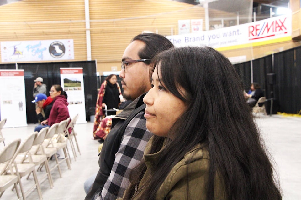 Catriona Henderson and her brother Braeden Emile listen to a presentation at the NStQ’s Citizen’s Assembly last week. (Patrick Davies photo - 100 Mile Free Press)
