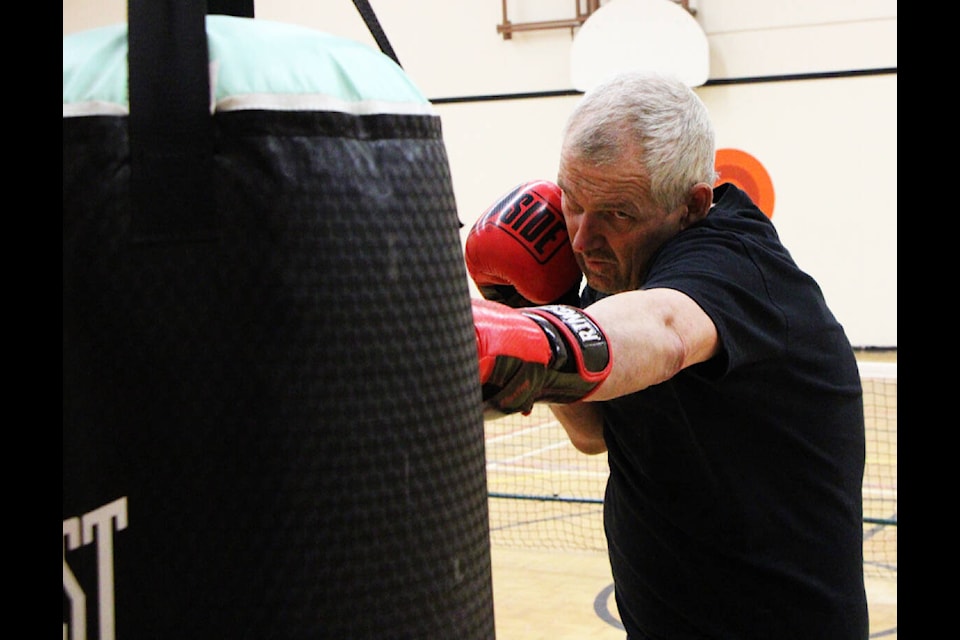 Paul Huber practices his boxing form in Buffalo Creek Elementary School’s Gymnasium. (Patrick Davies photo - 100 Mile Free Press)