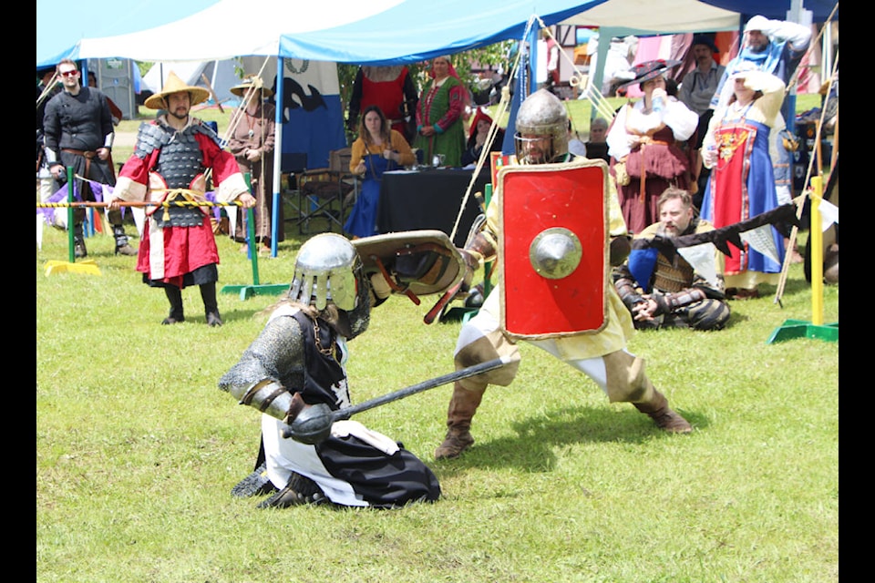 Two heavy fighters belonging to the Society of Creative Anachronisms duel during the Kingdom of An Tir’s June Coronet. (Patrick Davies photo - 100 Mile Free Press)
