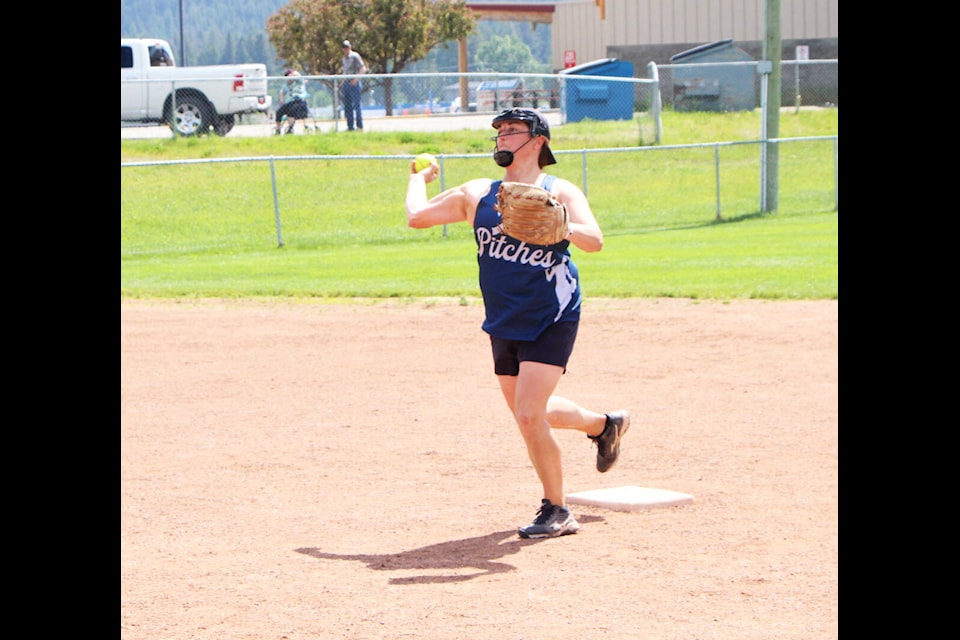 Those Pitches player Stacey Miller prepares to throw the ball to first base after tagging out a player on second during a game at the 100 Mile Women’s Slowpitch Tournament. (Patrick Davies photo - 100 Mile Free Press)