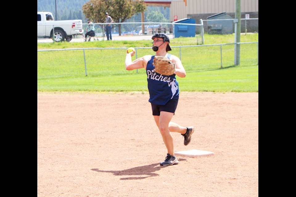 Those Pitches player Stacey Miller prepares to throw the ball to first base after tagging out a player on second during a game at the 100 Mile Women’s Slowpitch Tournament. (Patrick Davies photo - simplymastery)