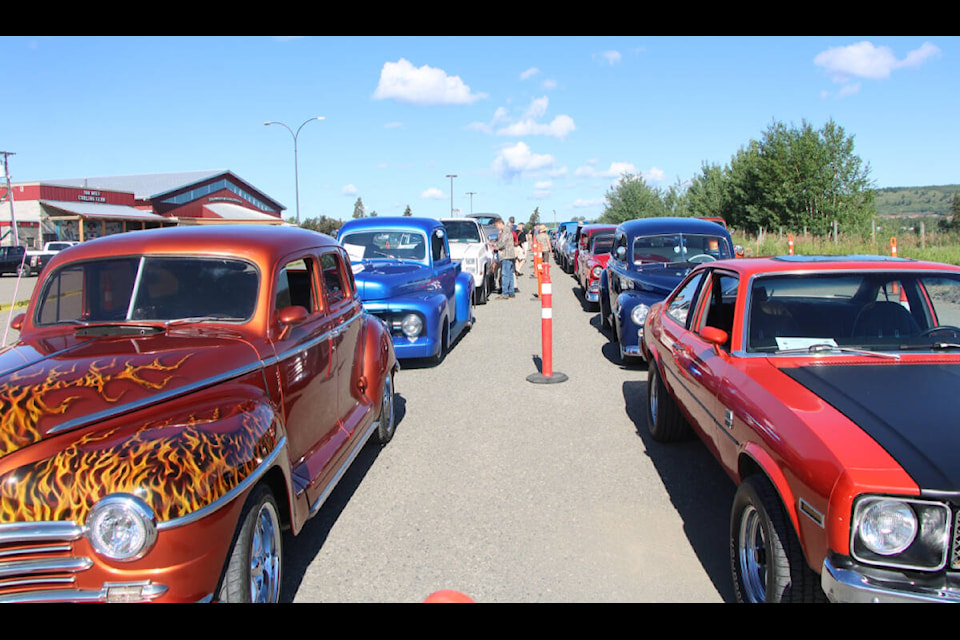 Hundreds of cars were parked at the South Cariboo Rec Centre Saturday in preparation for a poker run. (Patrick Davies photo - 100 Mile Free Press)