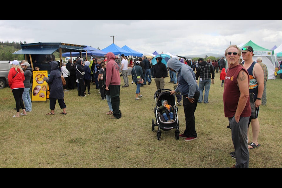 Attendees of the South Cariboo Garlic Festival line up for food. (Patrick Davies photo - 100 Mile Free Press)