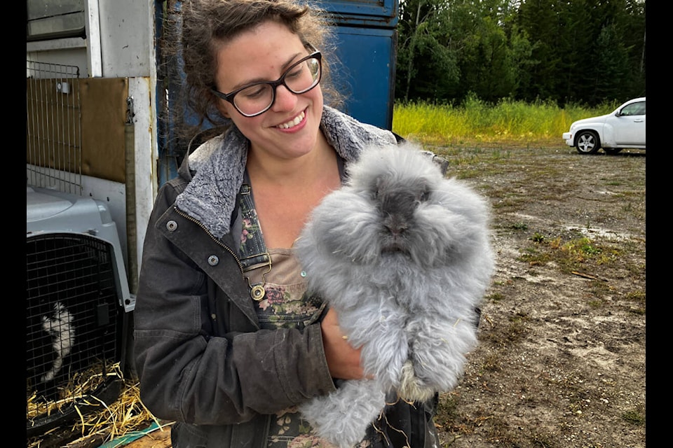 Isabelle Harper and her Angora rabbit at the Cariboo Central Interior Poultry Producers Association and New Cal Farms August Poultry Swap. (Fiona Grisswell photo- 100 Mile Free Press)