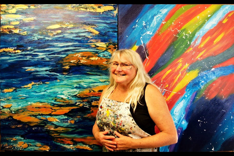 Eldy Birnie loves spending her retirement painting abstract paintings out of her home studio in Eagle Creek near Canim Lake. (Photo submitted)