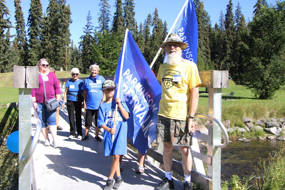 Around 15 members of the public took part in the 2022 South Cariboo Parkinson’s Super Walk this year including lead organizer Philip Konrad in front. (Patrick Davies photo - 100 Mile Free Press)