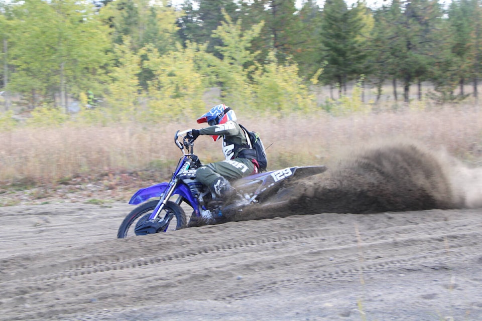 Kicking up a cloud of dust Derek Pole rips around a corner at the South Cariboo Track and Trail Dirtbike Association. (Patrick Davies photo - 100 Mile Free Press)