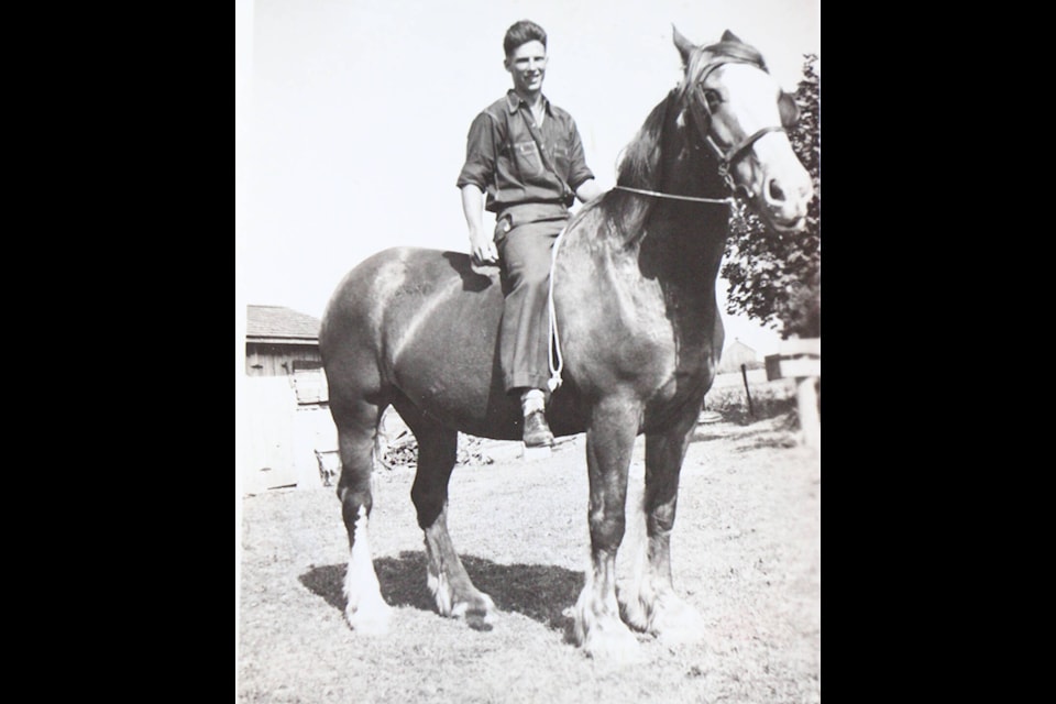 Alan McAninch rides atop a horse in the South Cariboo in the late 50s. (Photo submitted)