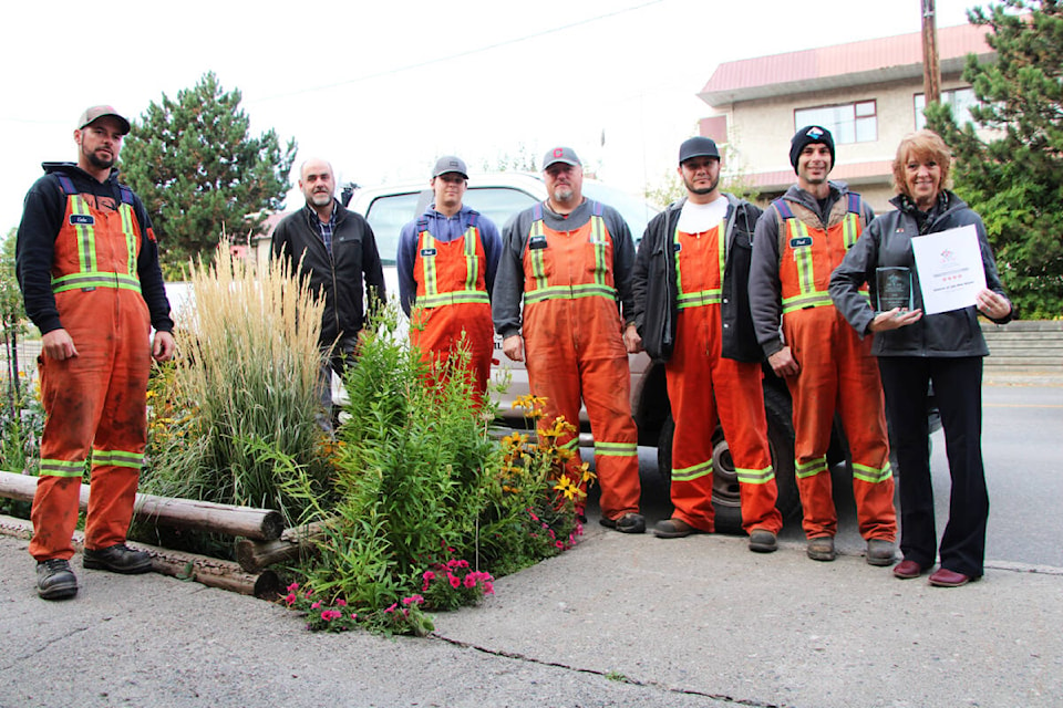 The District of 100 Mile House received four blooms from Communities in Bloom this year as well as the plant and floral arrangement award. Councillor Maureen Pinkney (far right) attributes this to the hard work of the District’s staff including Cole Abrams (left), Todd Conway, Brad Bissat, Barry Todd, Johnny Parker and Paul Donnelly. (Patrick Davies photo - 100 Mile Free Press)